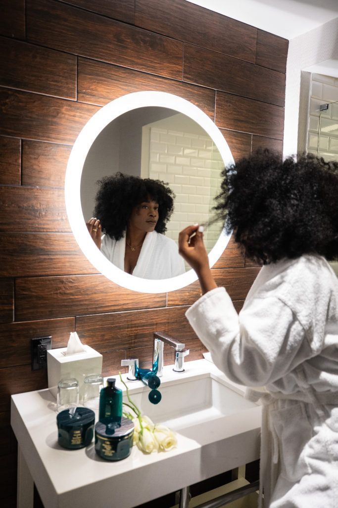 A woman caring for her hair at home